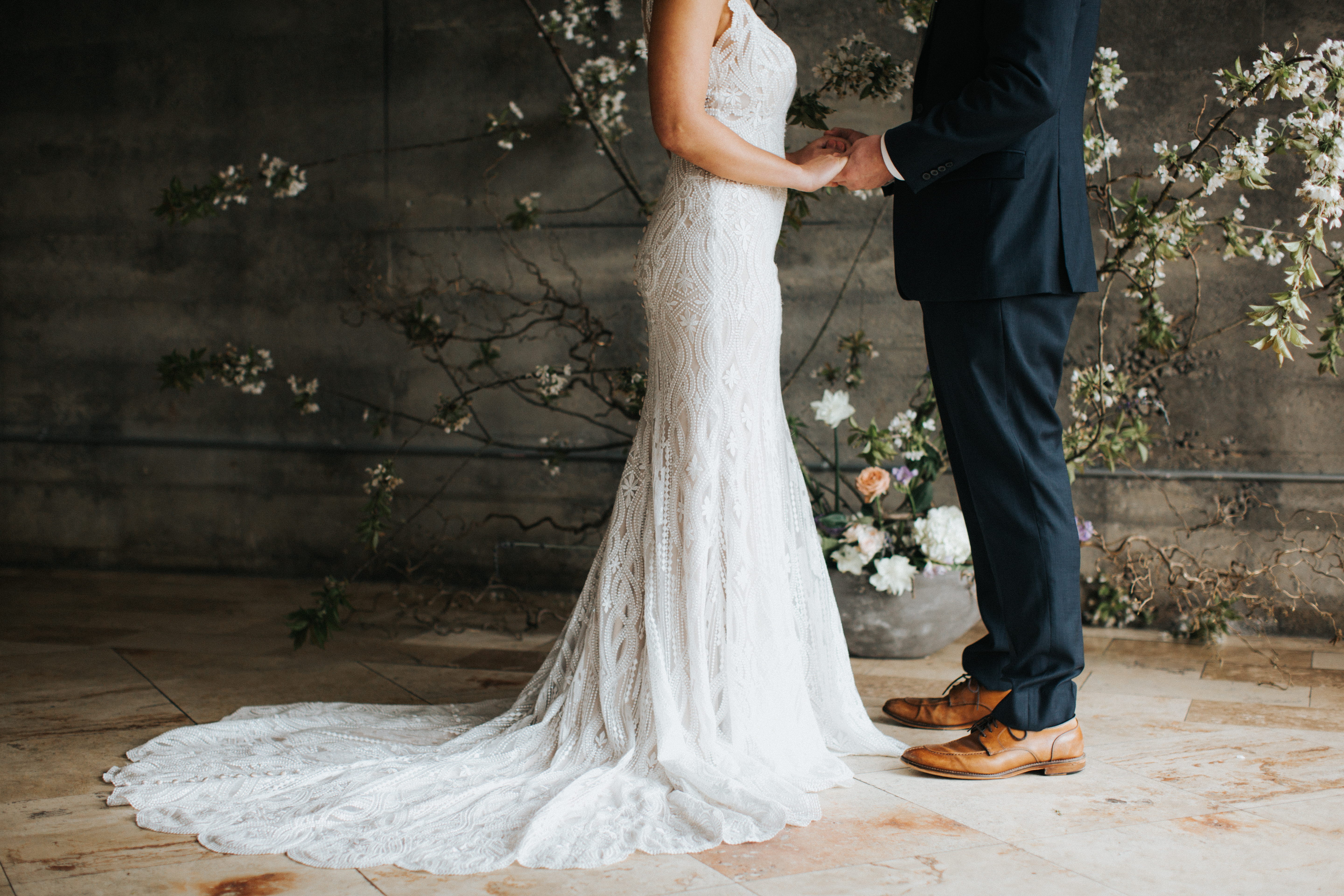 bride and groom holding hands